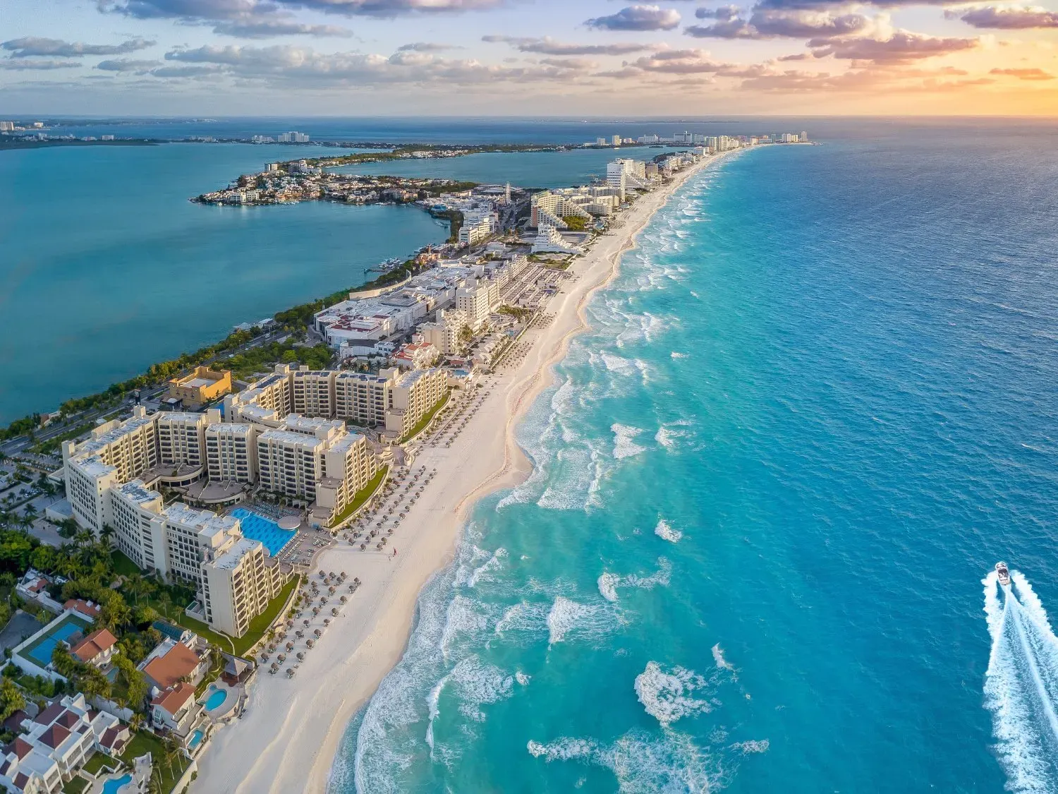 Cancun coast with sun.webp